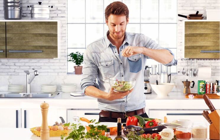 man preparing vegetable salad to increase potency